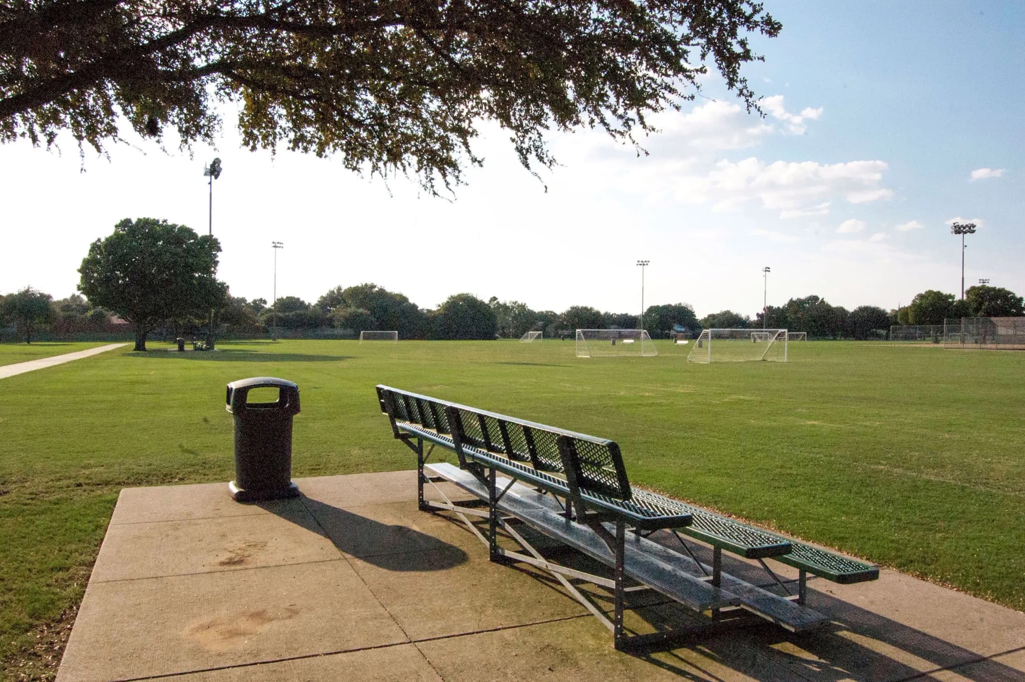 Cheyenne Park playground and green fields near River Bend in Plano