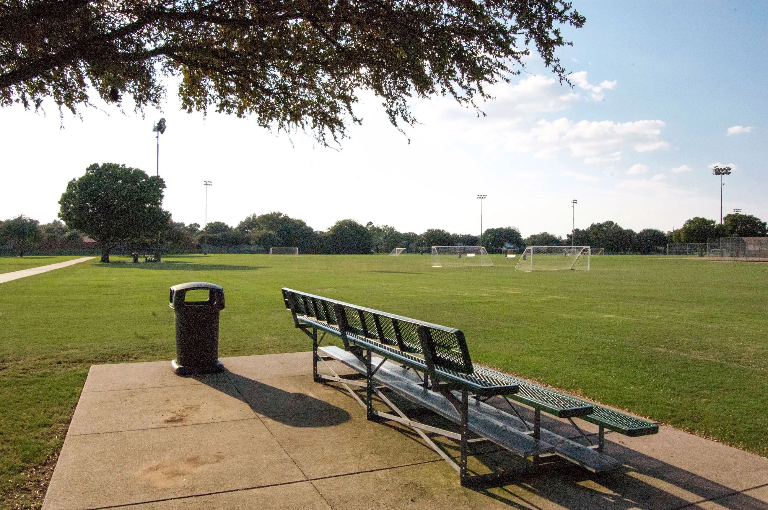 Cheyenne Park playground and green fields near River Bend in Plano